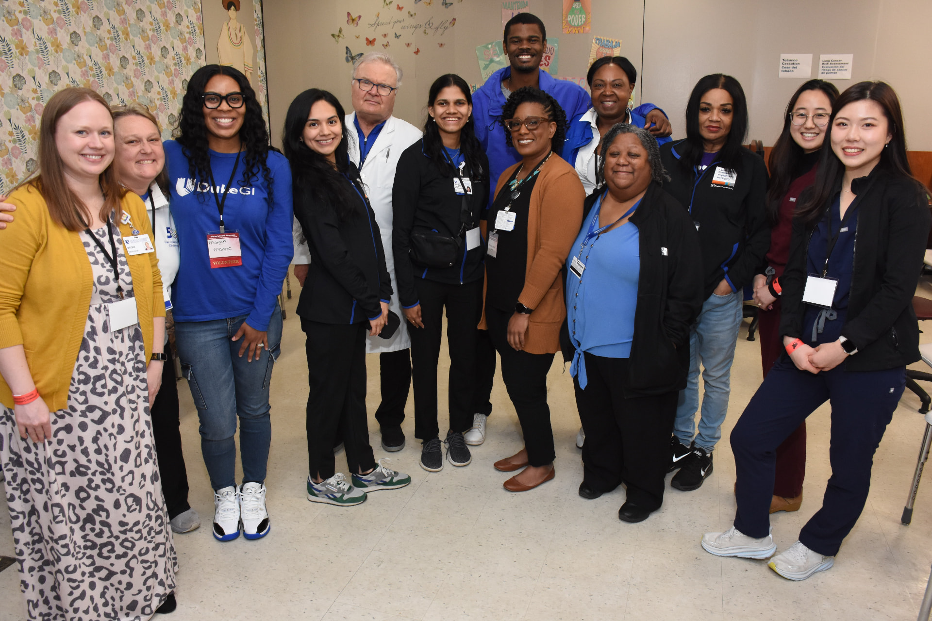 A large group of clinicians, volunteers and REGAL team members at a women's health screening event