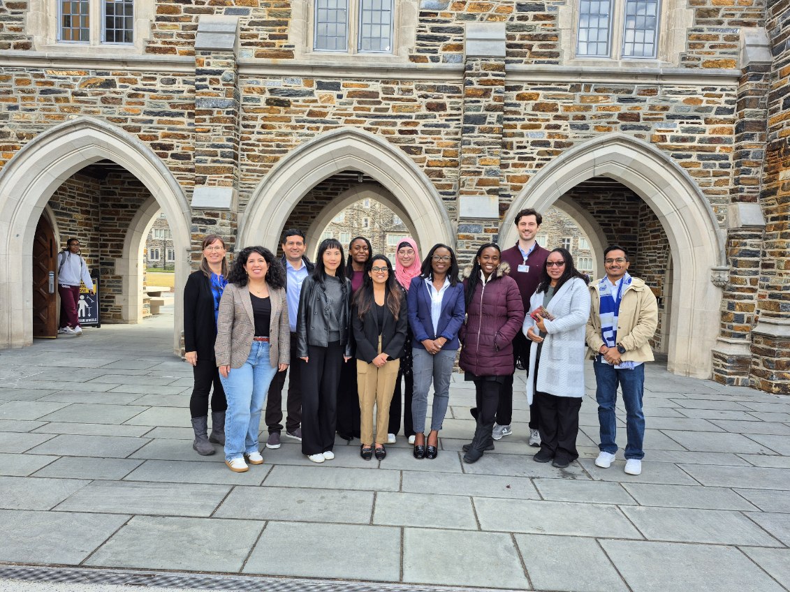 The REGAL team gathered outside a stone Gothic archway on Duke's campus during the 2026 team retreat