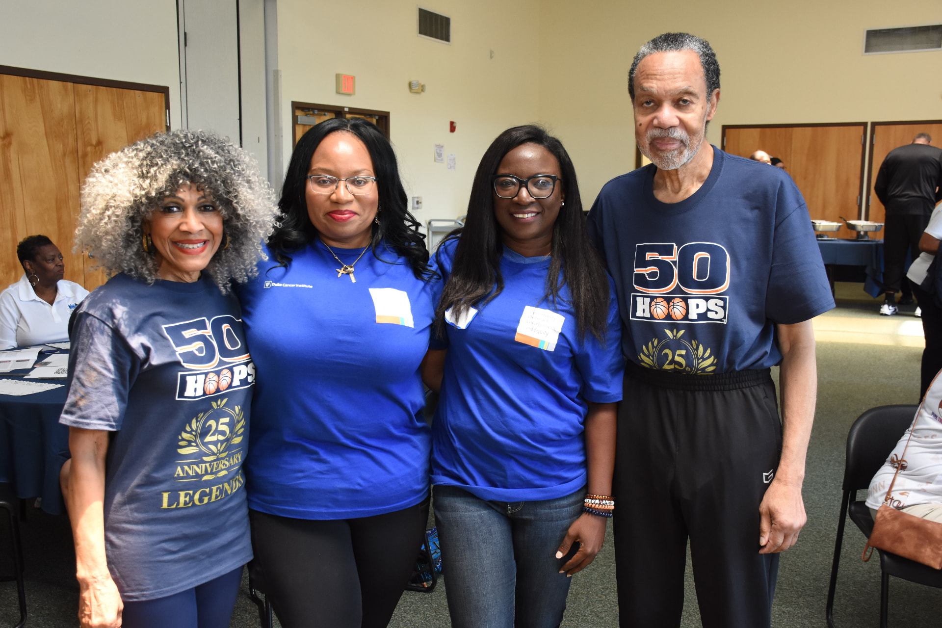 REGAL team members with community elders at the 50 Hoops prostate cancer awareness event