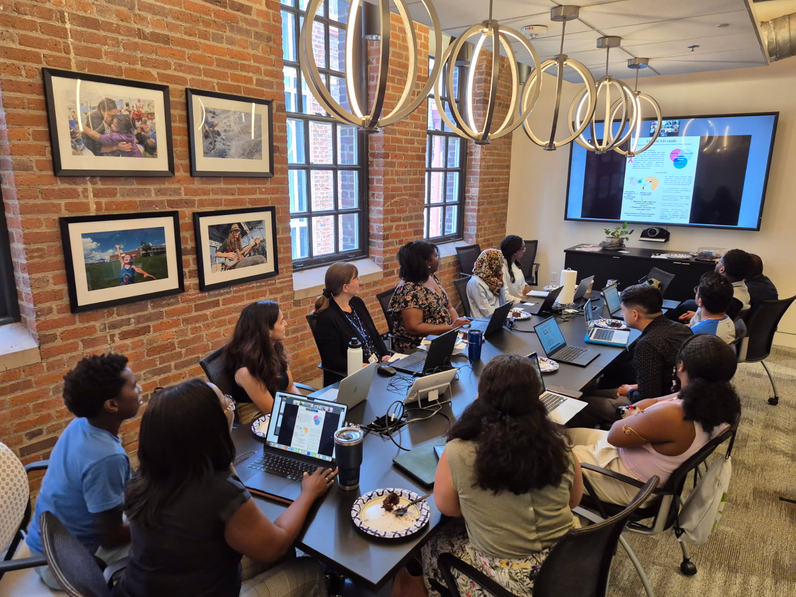 The REGAL team gathered around a conference table for a bi-weekly meeting